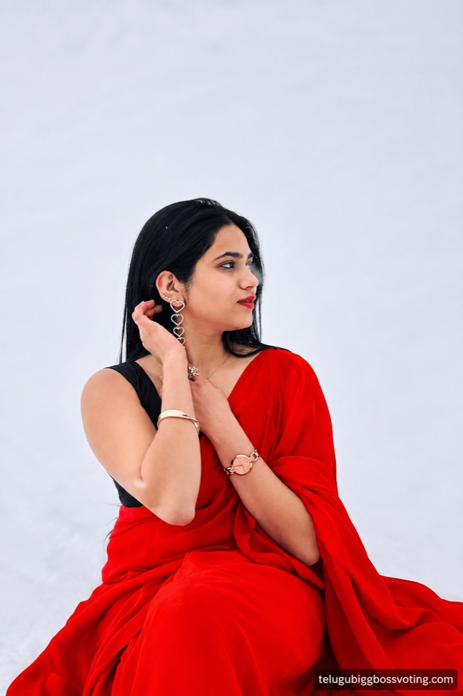 Illustrated portrait of Shalini Damera modelling a red saree against a plain white backdrop